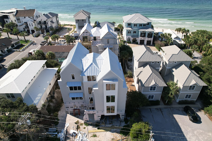 High-performance standing-seam metal roofs for a multi-unit beachfront development.